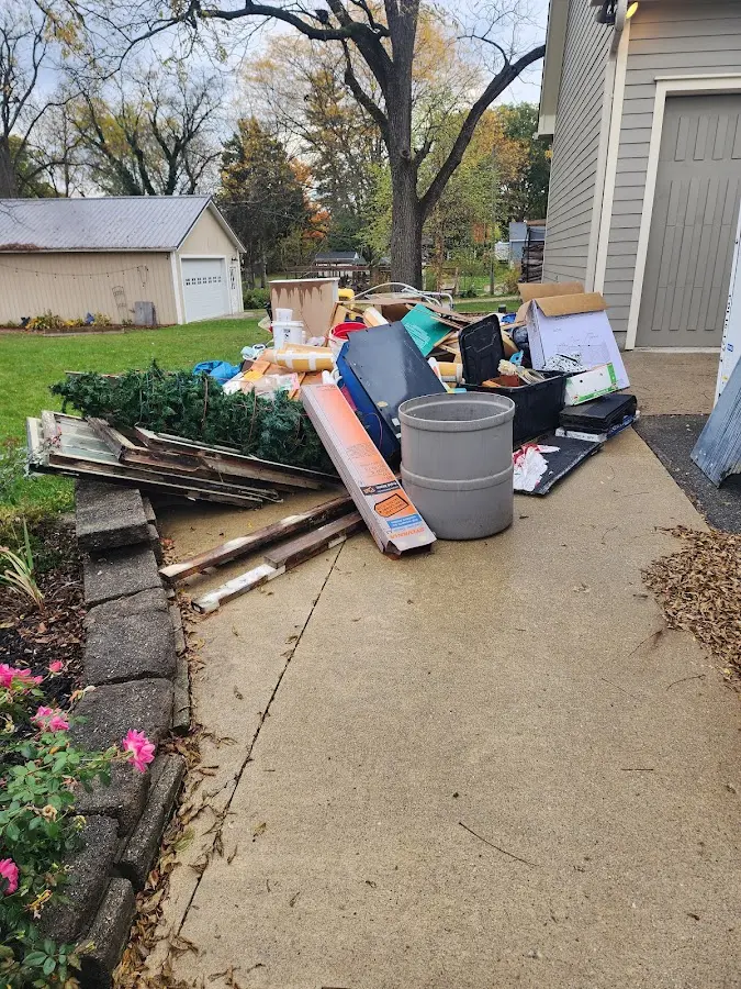 Dumpster being loaded with debris for Commercial Dumpster Rental in North Kensington